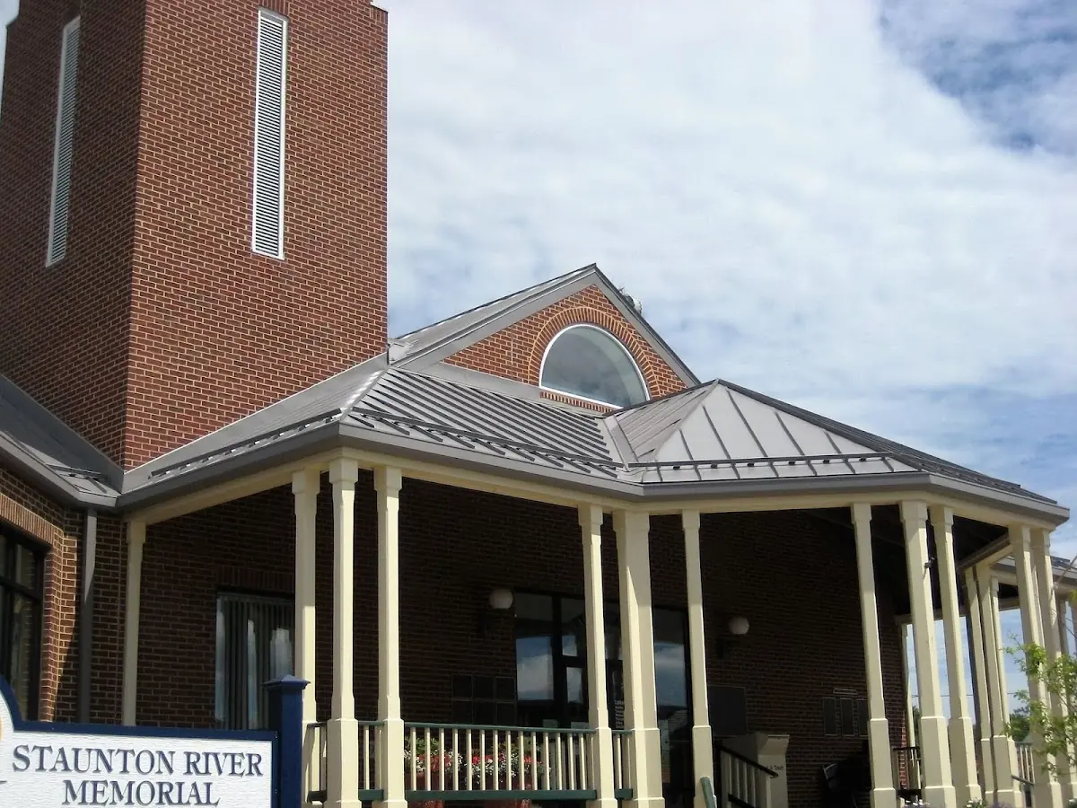 Skilled roofing craftsmen working on a residential roof in Collinsville
